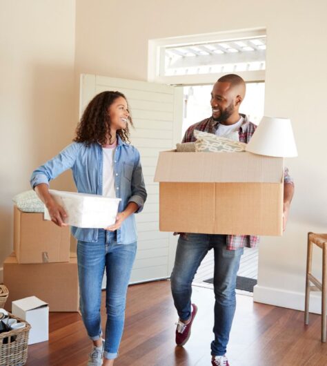 happy couple moving into denver house