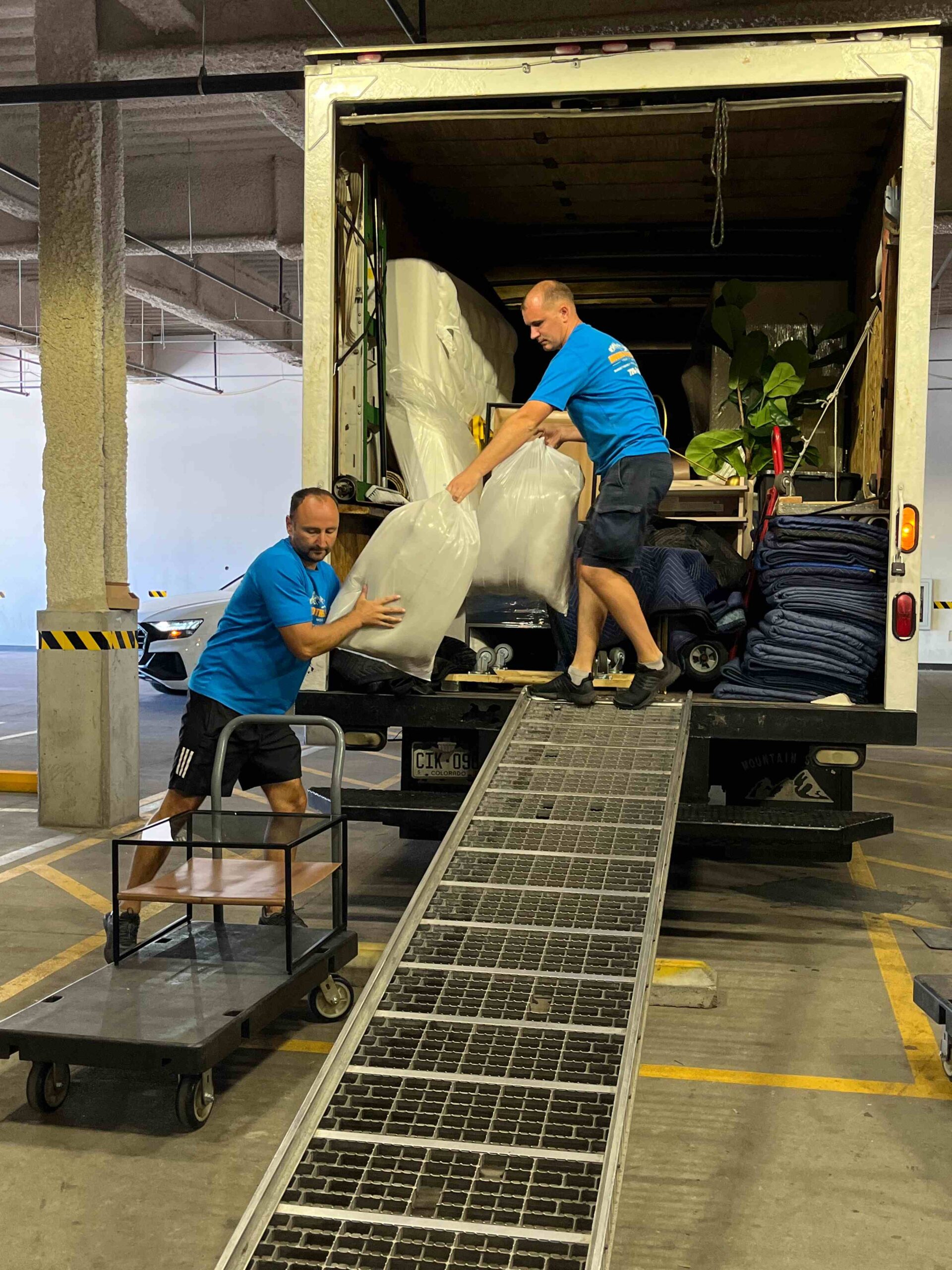 Movers carefully unloading the truck