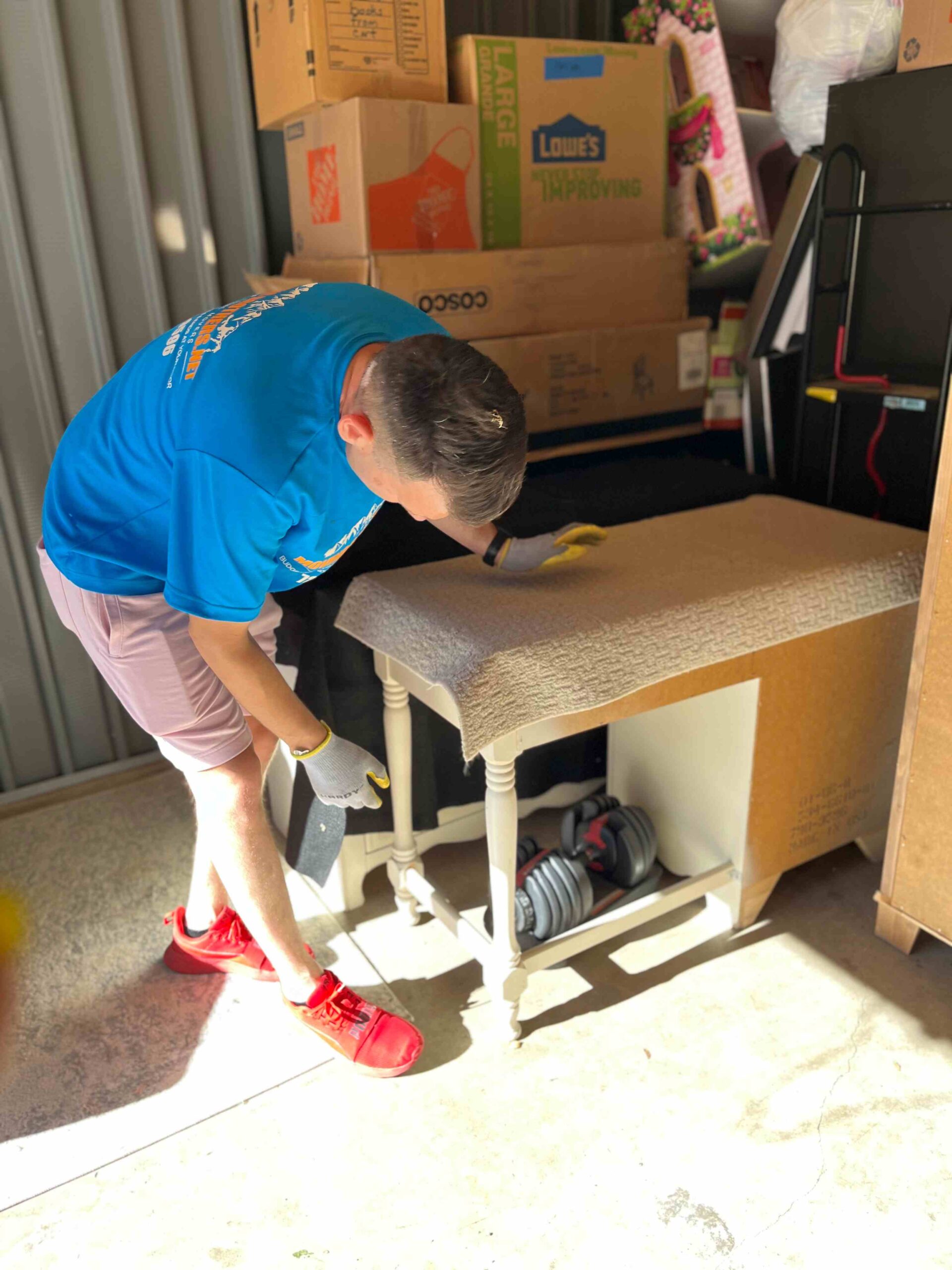 Movers carefully packing table