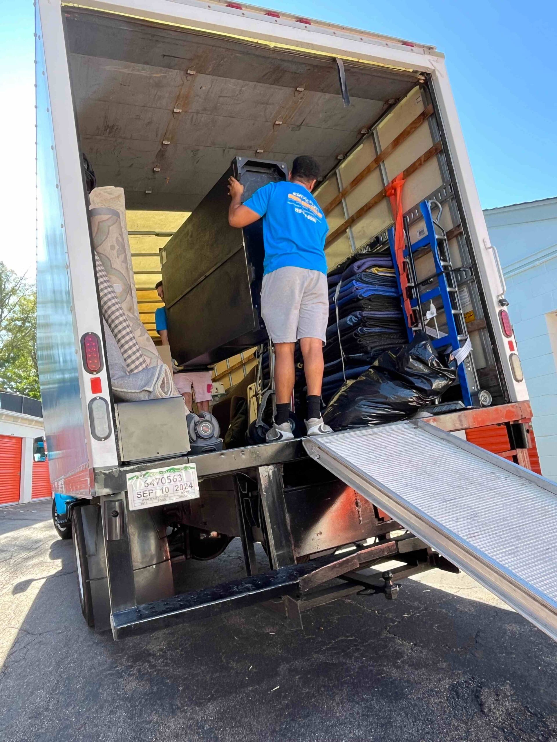 Moving team loading belongings on the truck