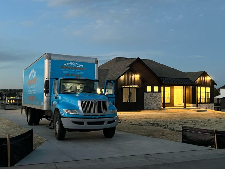 Moving truck outside a four-bedroom Denver home